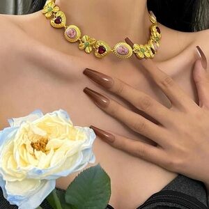 Gold Floral Necklace with Pink and Red Accents